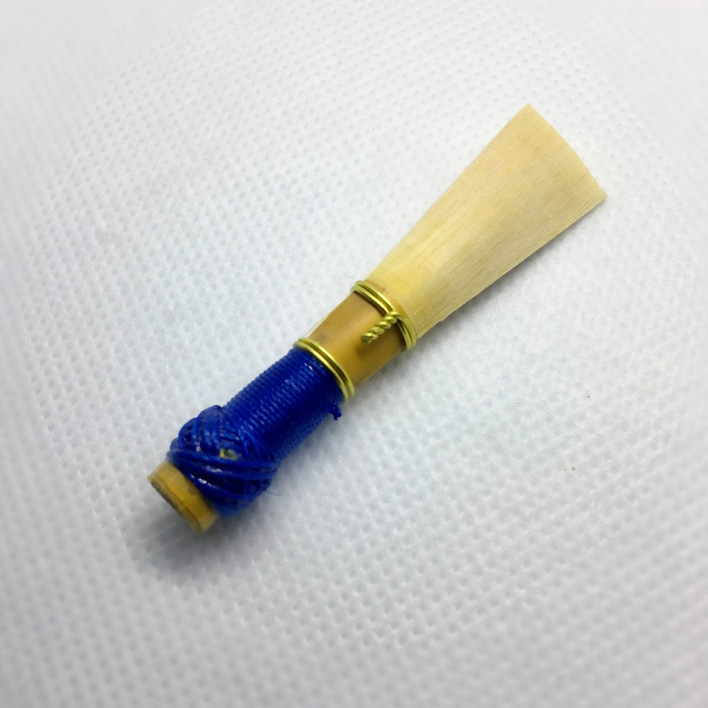 Mallar student bassoon reed. The bassoon reed features blue thread and quality bassoon cane